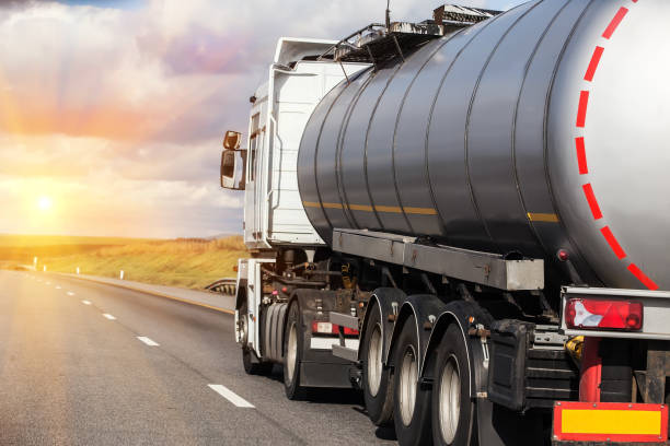 Big gas-tank goes on highway against the sky
